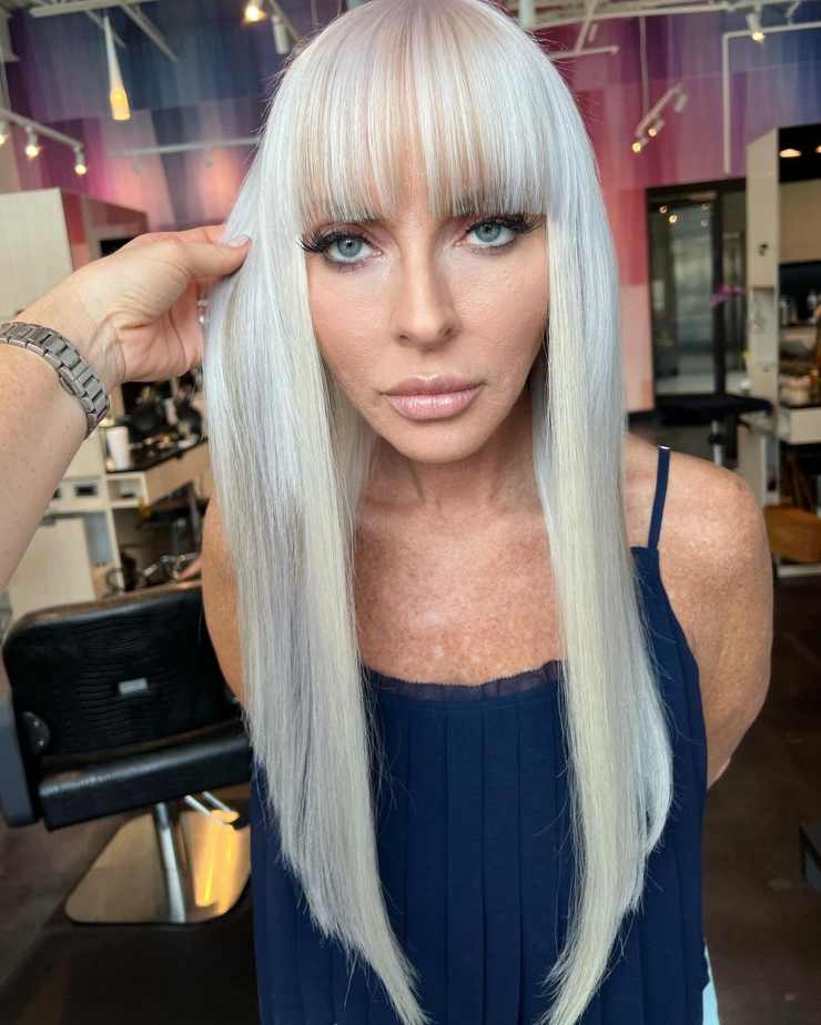 tagli di capelli viso allungato lungo con frangia biondo
